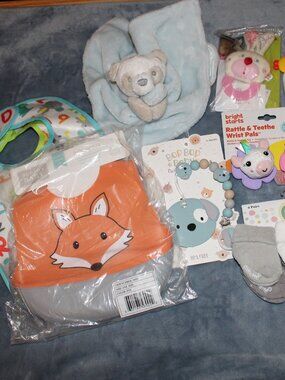 Lot of Baby Bibs Toys and Other Items Some New Some Used